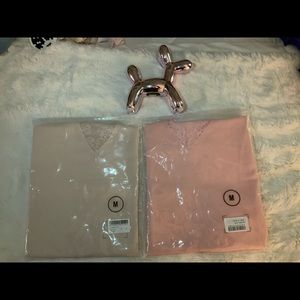 Two tank top shirts both never used